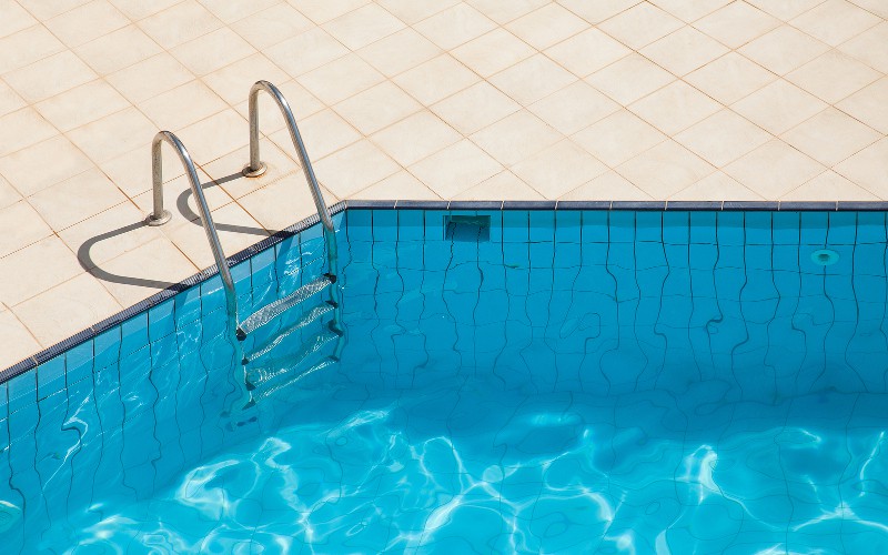 Inground swimming pool with tile deck