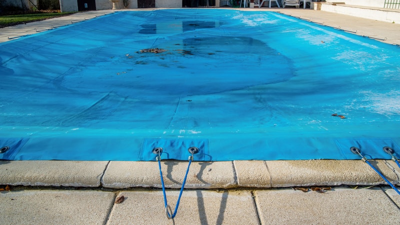 A conventional swimming pool cover