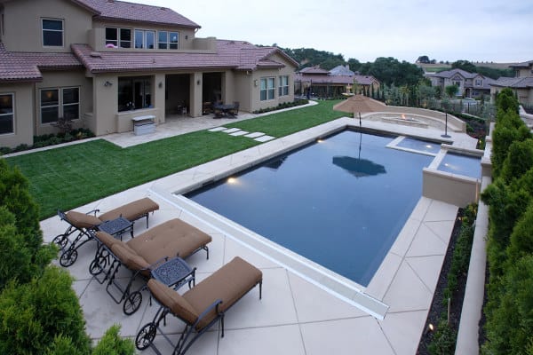 Lighted pool with spa and fire element