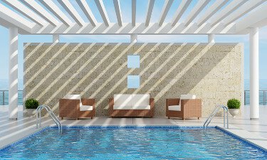 Luxury pool partially shaded by a pergola
