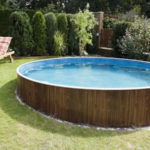 Picture of an above ground pool that's slightly buried