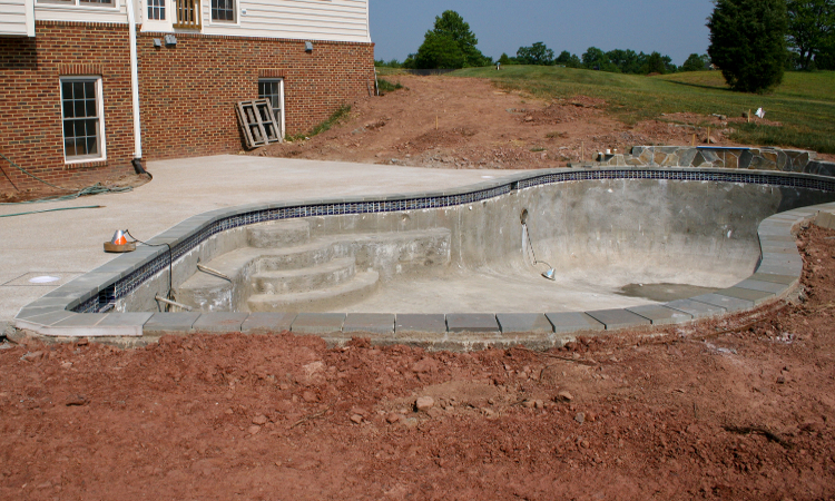 Photo of concrete pool construction illustrating differences between fiberglass and concrete pools