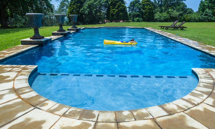 Photo of a roman end pool, illustrating differences between fiberglass and concrete pools