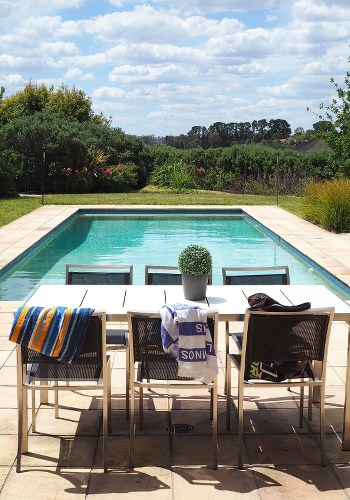 Photo showing good pool deck orientation with chairs facing a scenic view